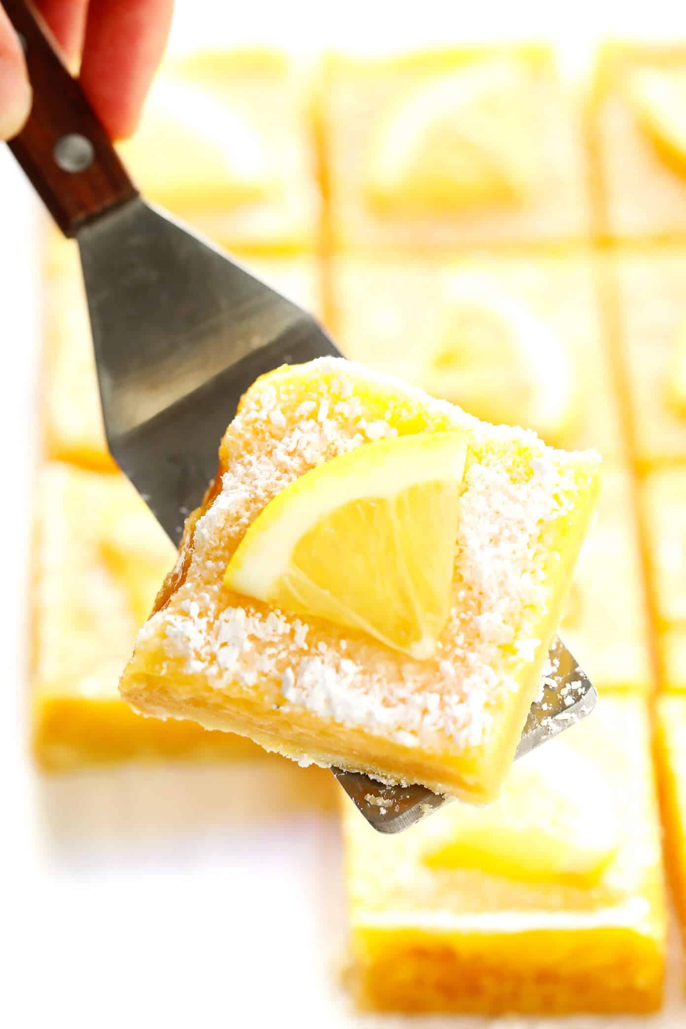 Learn how to make the best lemon bars with this 5-ingredient easy lemon bars recipe! It's a simple summer dessert that only requires 15 minutes of prep time, and it's always a crowd fave! | gimmesomeoven.com #lemon #dessert #bars #easy #summer #spring #easter Lemon Bars