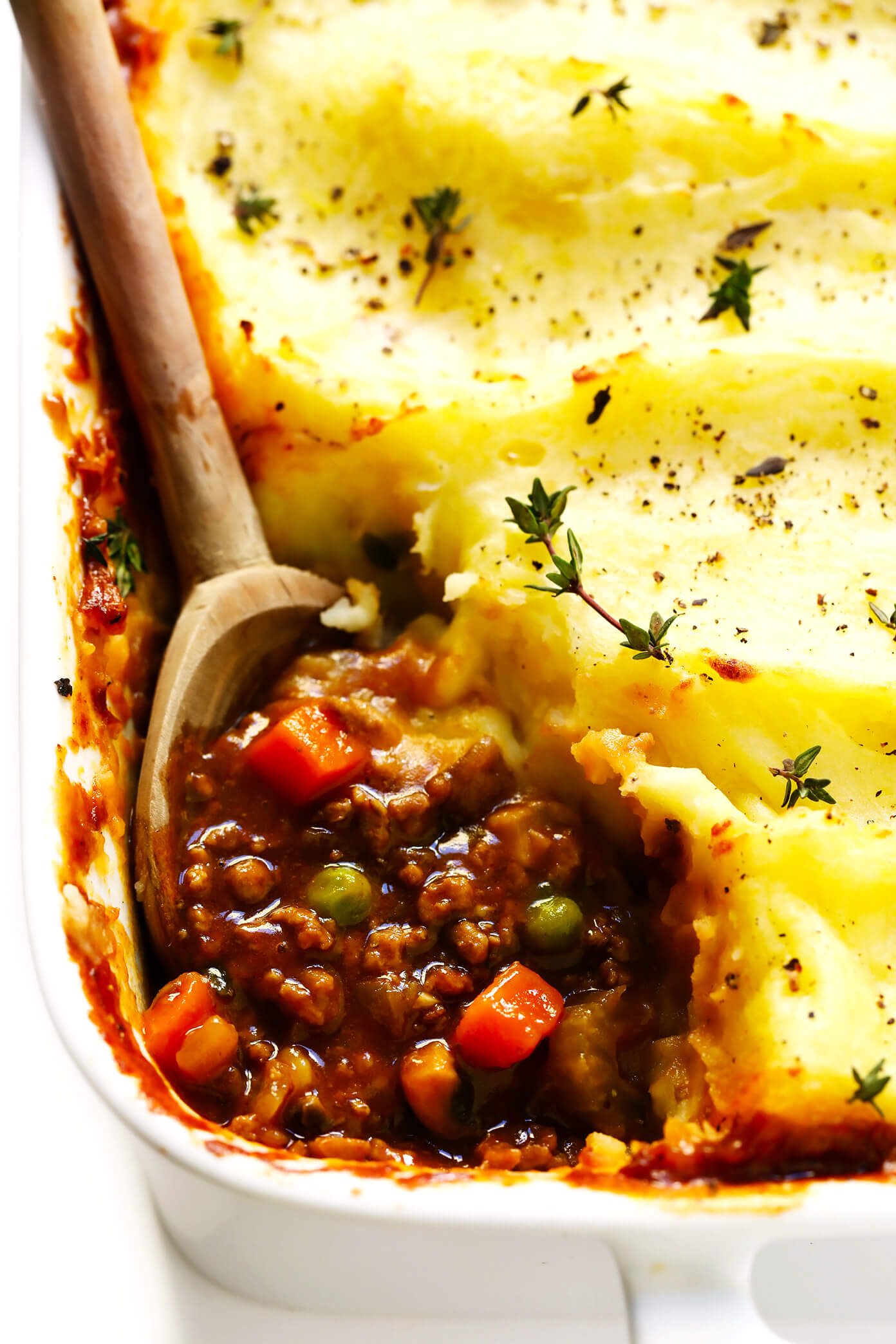 This easy Shepherd's Pie recipe is filled with lots of veggies and tender ground beef or lamb, simmered together in the most delicious savory herb sauce, and topped with the creamiest mashed potatoes. Perfect for St. Patrick's Day, or anytime you're craving some delicious Irish comfort food. | gimmesomeoven.com #shepherdspie #stpatricksday #irish #beef #mashedpotatoes #mealprep #dinner #casserole Shepherd's Pie Recipe