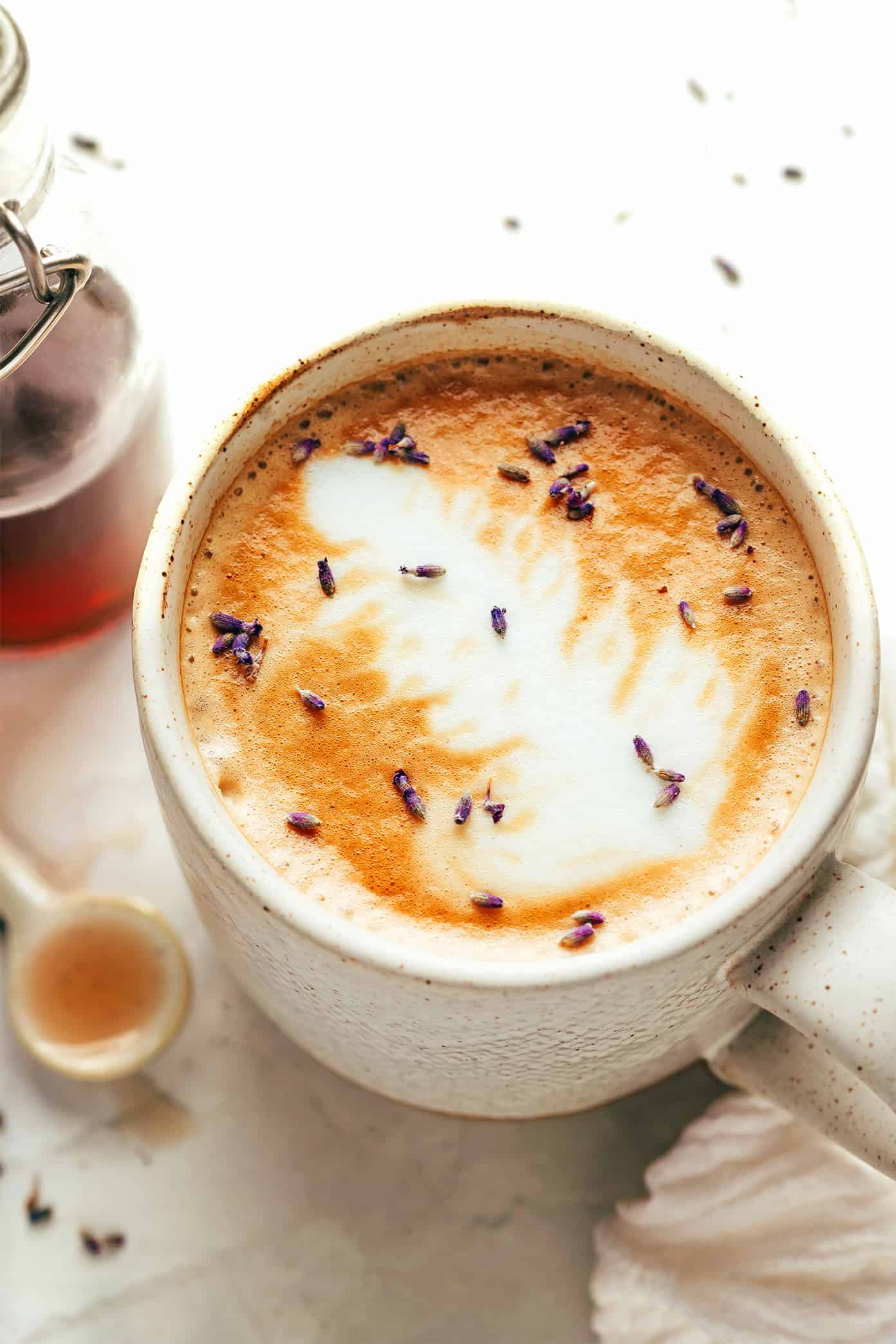 This homemade lavender latte recipe can be made hot or iced and is easy to customize with your favorite milk, espresso and add-ins. So delicious and less expensive than the coffee shop version! | gimmesomeoven.com Lavender Latte