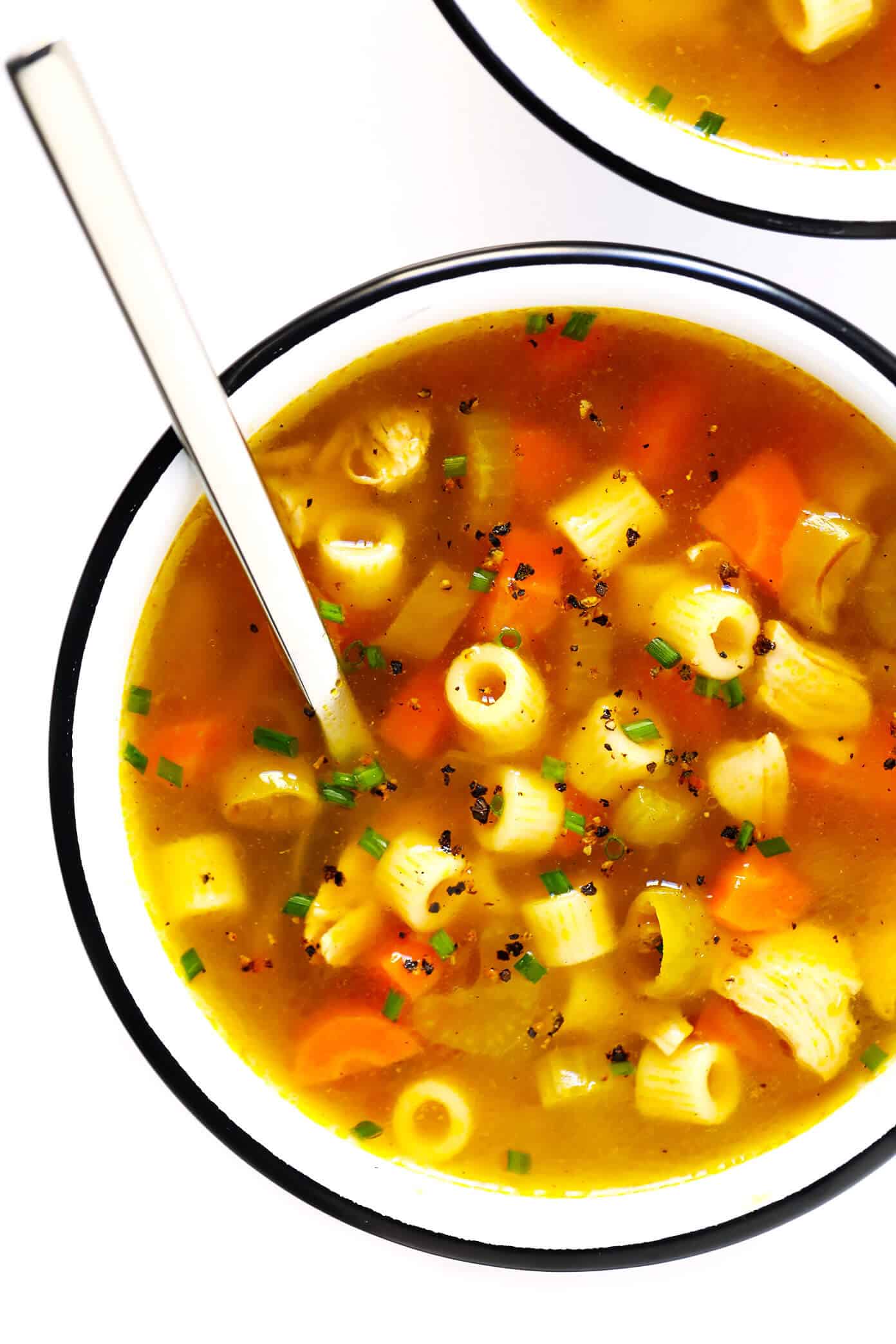 LOVE this Spicy Pepperoncini Chicken Noodle Soup recipe! It's quick and easy to make, and the pepperoncini peppers add the perfect extra bit of heat and tang. Total comfort food! | gimmesomeoven.com #soup #chicken #chickennoodlesoup #pepperoncini #italian #spicy #comfortfood #dinner #recipe Pepperoncini Chicken Noodle Soup