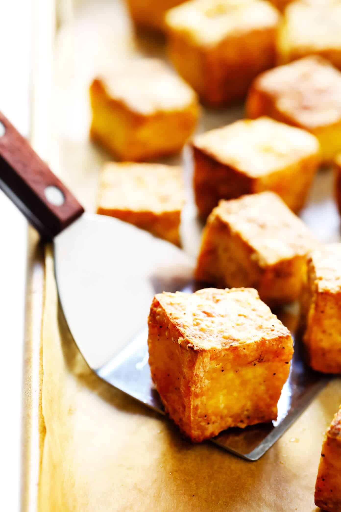 This 30-Minute Crispy Baked Tofu recipe is the BEST! It's quick and easy to make, totally customizable with your favorite seasonings or sauces, naturally gluten-free and vegan, and perfect for adding to a soup, stir-fry, curry, or whatever sounds good. | Gimme Some Oven #tofu #healthy #vegetarian #vegan #glutenfree #dinner #recipe Crispy Baked Tofu Recipe
